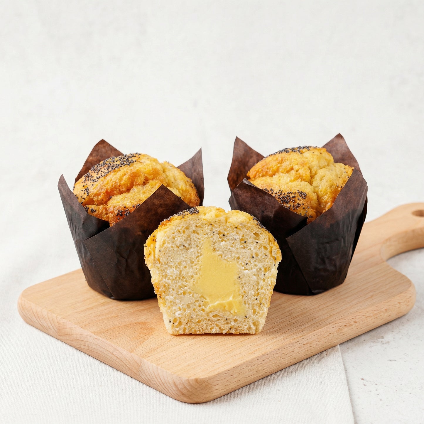 Lemon Chia Seeds Muffin with Lemon Filling on wooden board