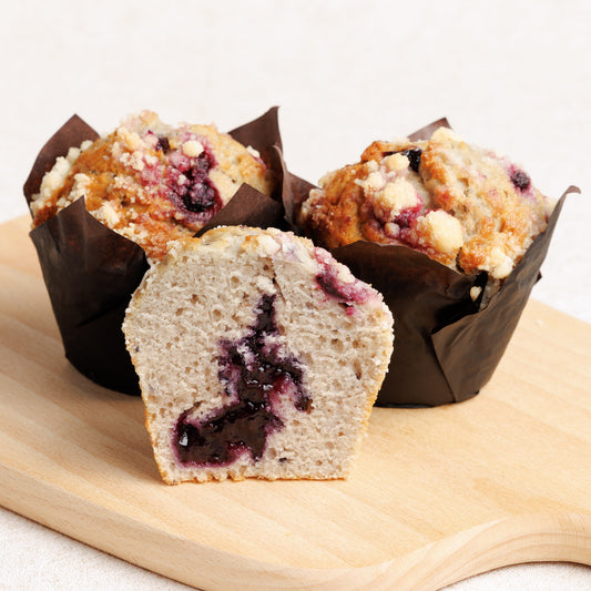 Blueberry Crumble Muffins with Blueberry Filling on wooden board