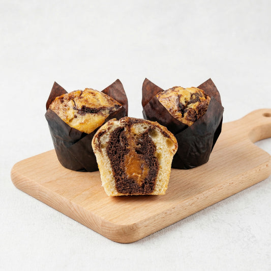 Chocolate Marble Muffin with Caramel Filling on Wooden Board