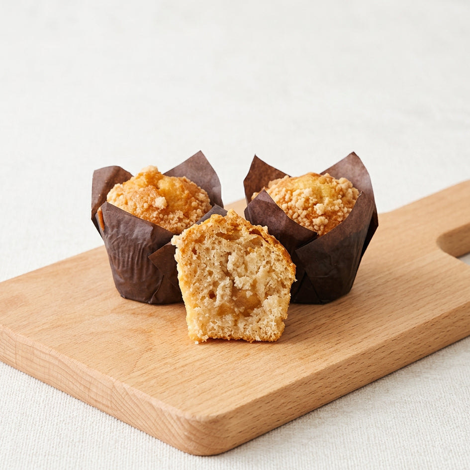 Apple cinnamon mini muffin with apple filling on wooden board